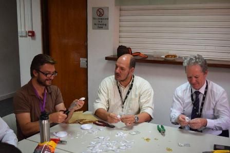 High Commission staff making ribbons for White Ribbon Day